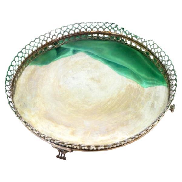 Silver tray with wire rack and resting on four cut-out feet