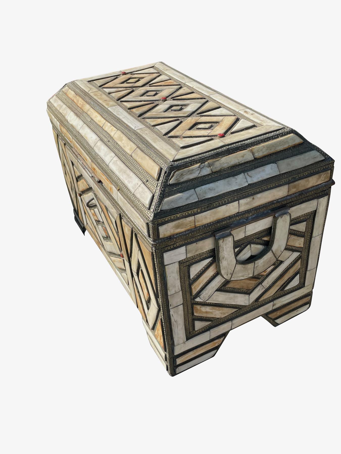19th century Moroccan bone inlay box.
Decorative silver trim.
Geometric pattern design.