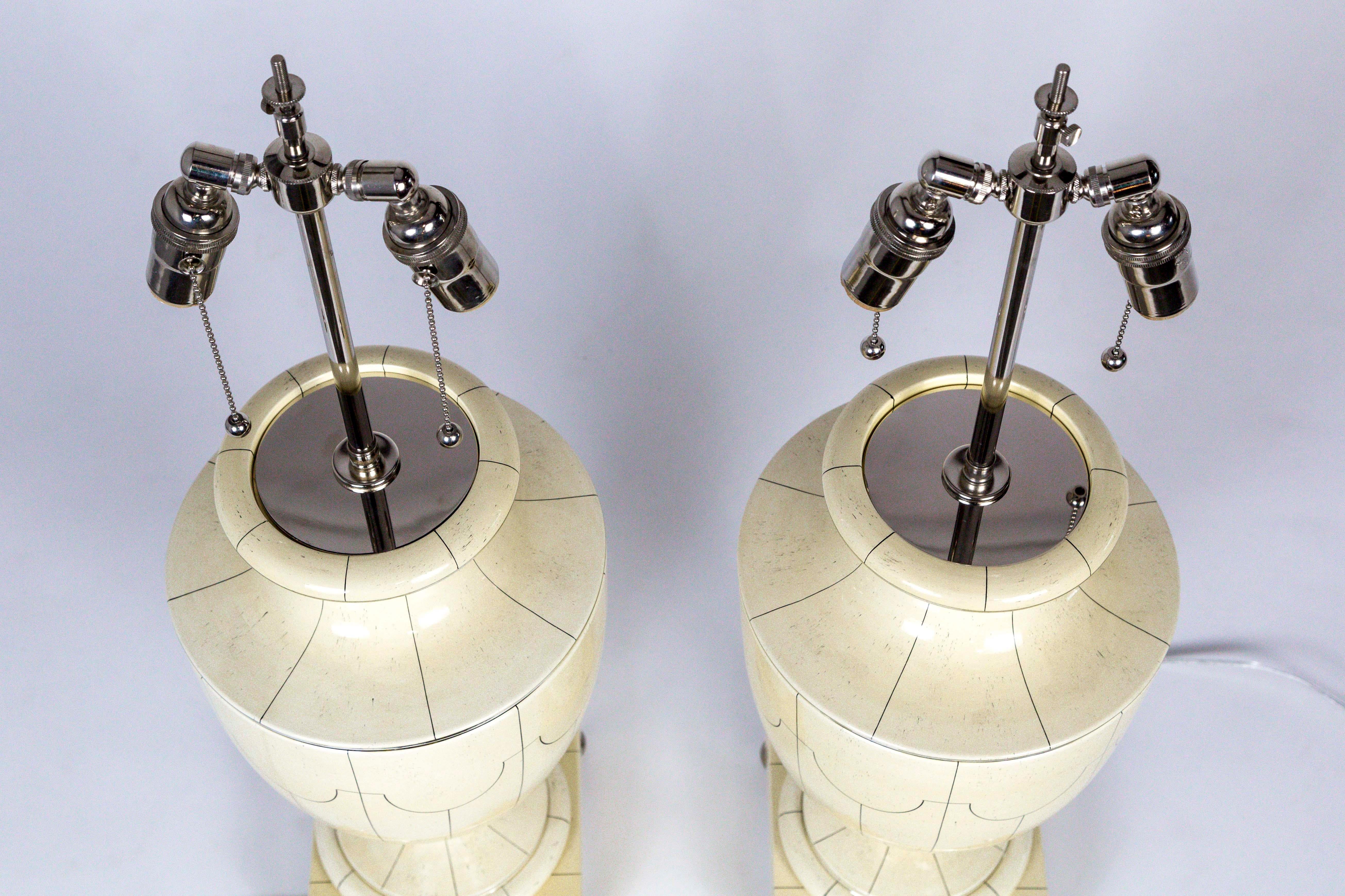 Metal Silver Trimmed Ivory Ceramic Urn Lamps by Jean Roger