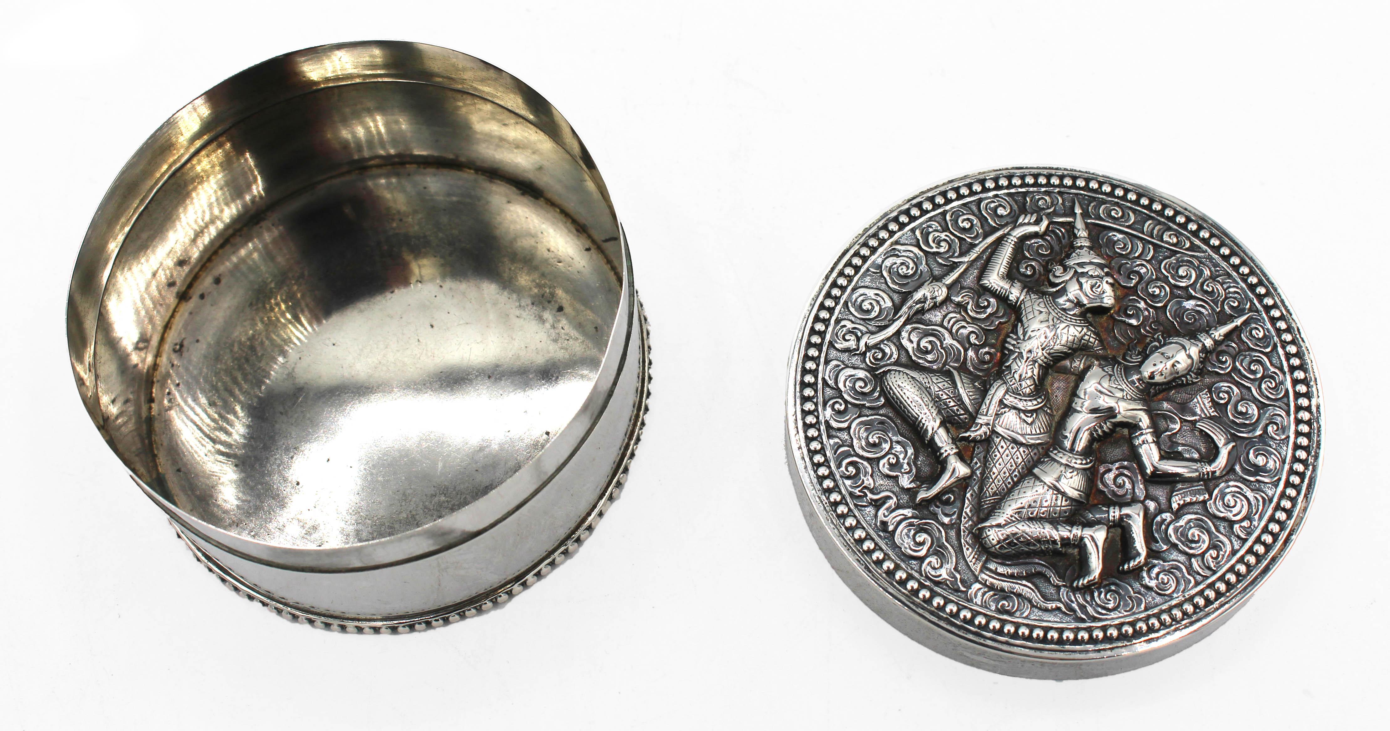 Silver trinket box, Thai, circa 1925. Decorated with monkey god & human consort; Khemer tradition. From the collection of the famous ichthyologist Dr. Hugh McCormick Smith. Inscribed 