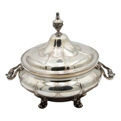 Silver tureen with eight sections, floral reliefs 
acanthus feet