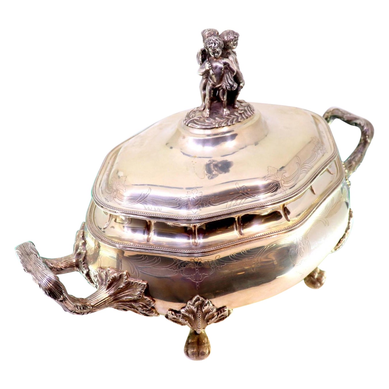 Silver tureen with engravings, friezes, acanthus handles 
claw feet