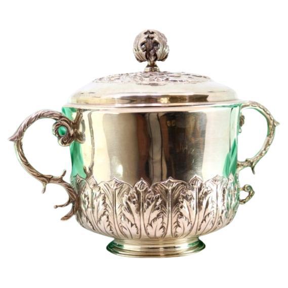 Silver tureen with reliefs, two handles 
beaded circular base For Sale