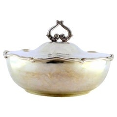 Silver tureen with wavy rim and openwork handle on the lid
