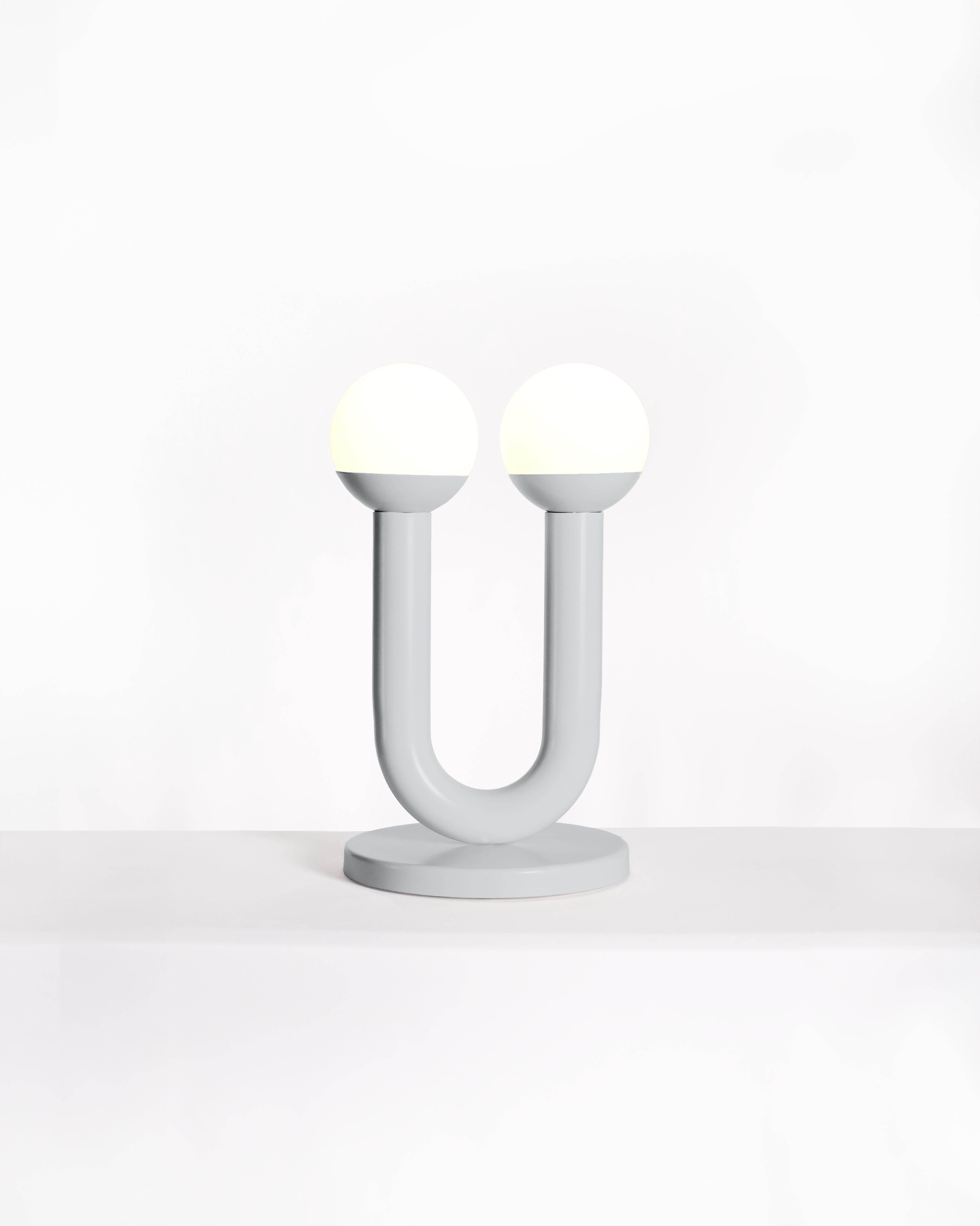 Silver Umu Sculptural Table Lamp by Drusch Design
Dimensions: W 27 x D 27 x H 43 cm
Materials: 2-inch iron pipe and 13cm diameter frosted glass screen.
Weight: 5 kg. 

The UMU table lamp, combines design and functionality into an elegant art object.