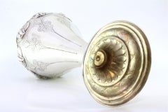 Silver vase with floral motifs and frilled circular base