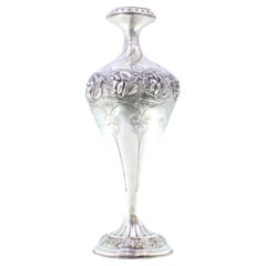 Silver vase with floral motifs and frilled circular base Silver vase with floral motifs and frilled circular base
