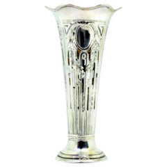 Silver vase with floral motifs suspended around monogram cards and wavy edges