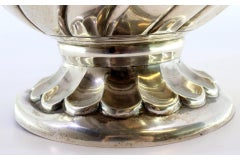 Silver vase with fluted rim and base, floral engravings, and rope frieze