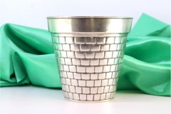 Silver vase with mural-effect reliefs and frills on the edge