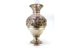 Silver vase with relief flowers, swan figures, and engraved friezes on base
