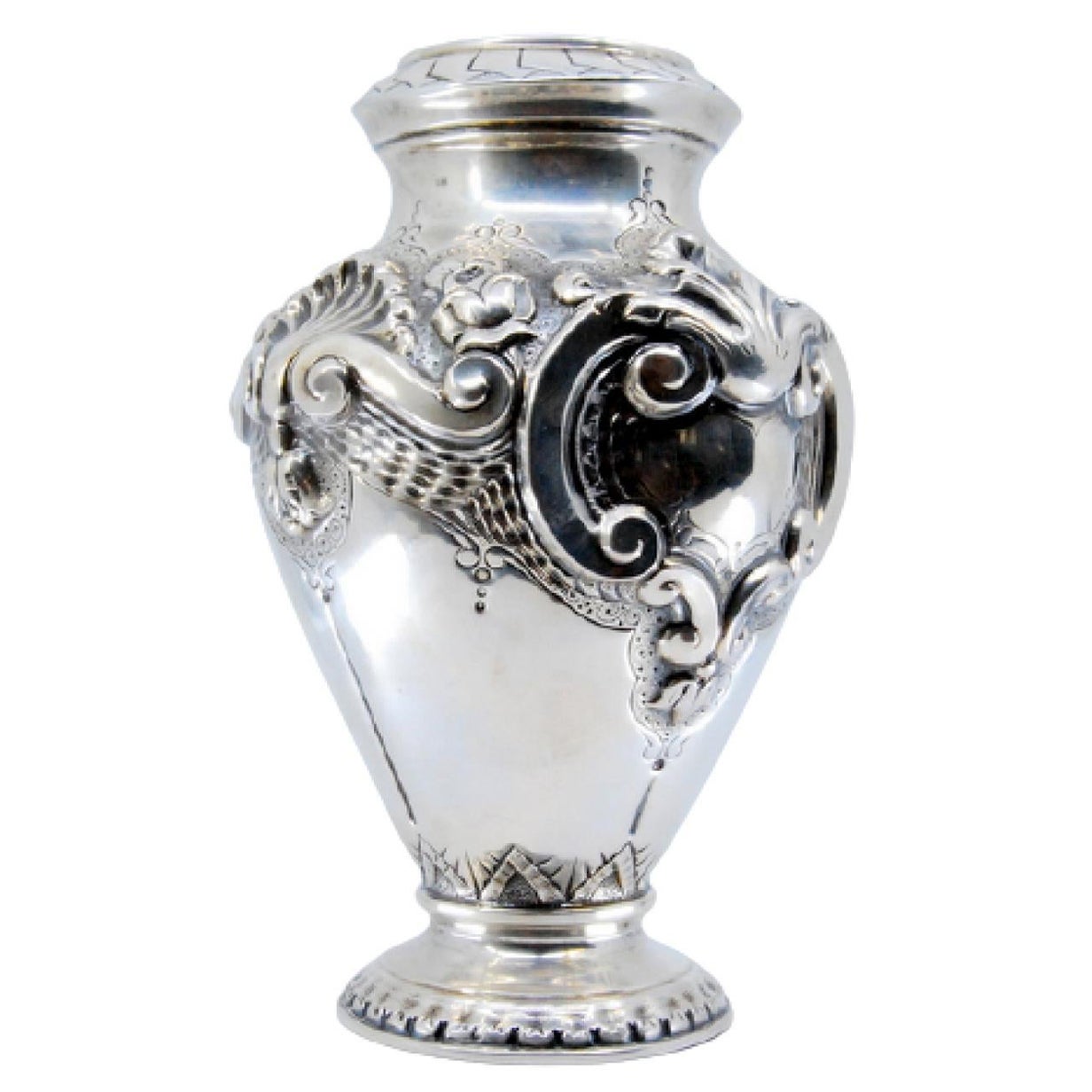 Silver vase with reliefs of shells and flowers with a circular base