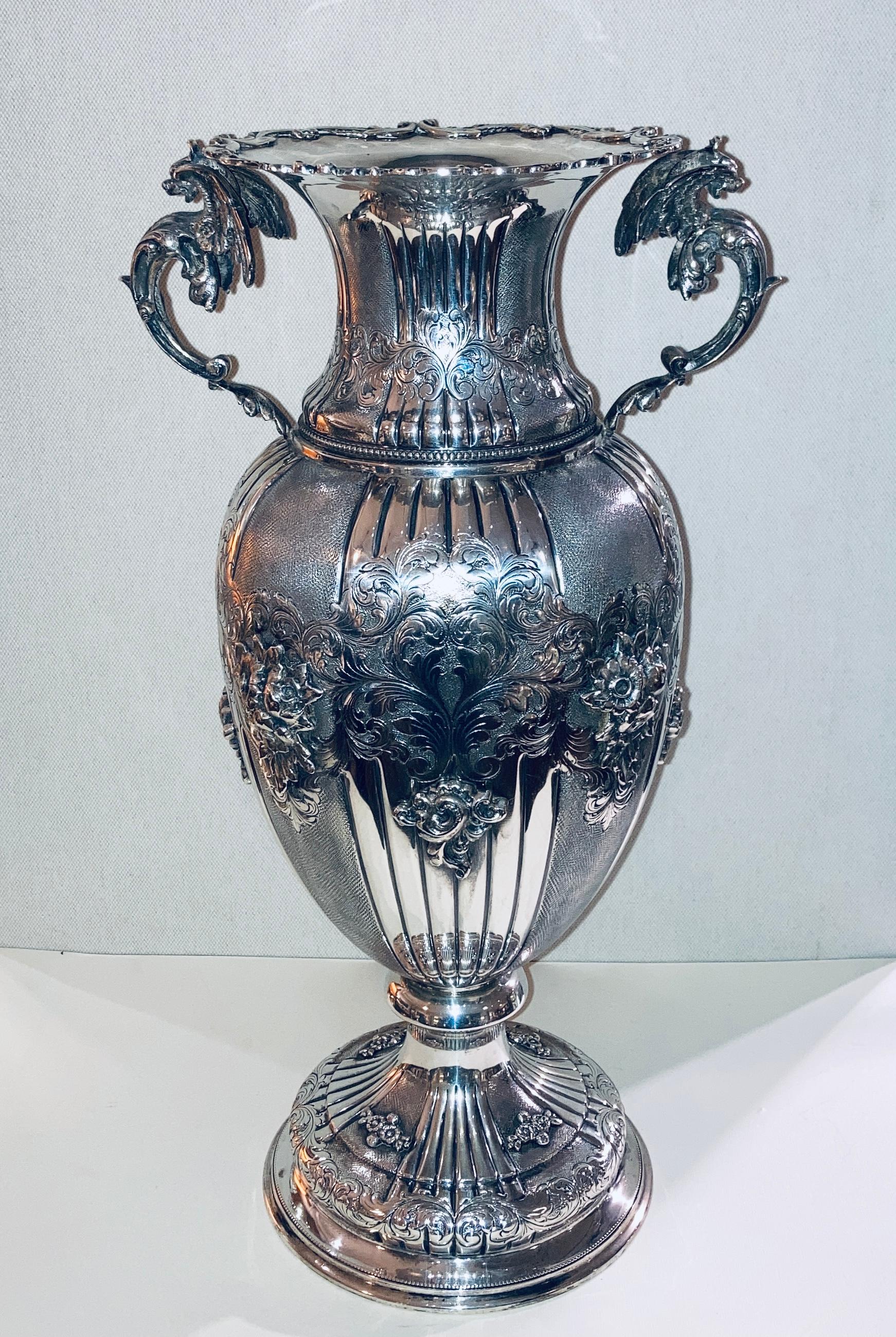 Silver vase Renaissance style, handles with winged dragons, flowers.
Italian manufacture, 1960
weight 1600gr.