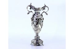 Silver vase with ribbons, garlands, flowers, and acanthus leaves on 4-foot base