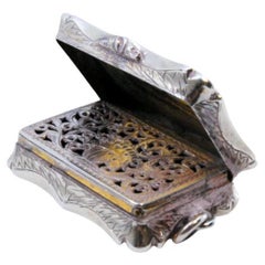 Silver vinaigrette box with engraved lid and Victorian hanging ring