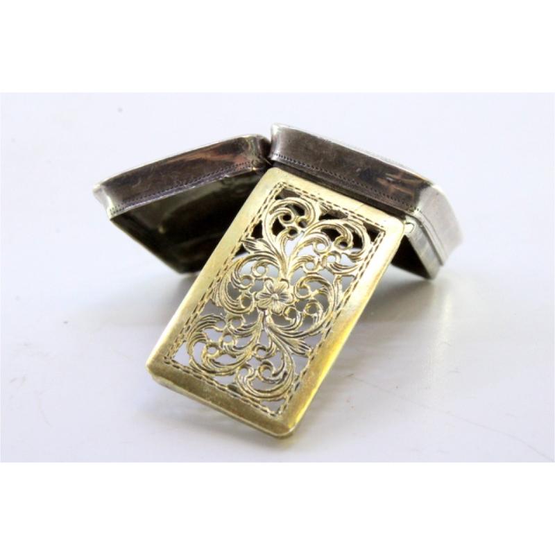 Description: Silver vinaigrette box with guilloche motifs on the hinged lid from the Victorian period. Metal: Silver. Origin: English. Brand: Birmingham. Weight: 10.98 grams. Dimensions: 3cm x 2cm. Content: 925/1000. Assay Mark: Yes, 1842 by Joseph