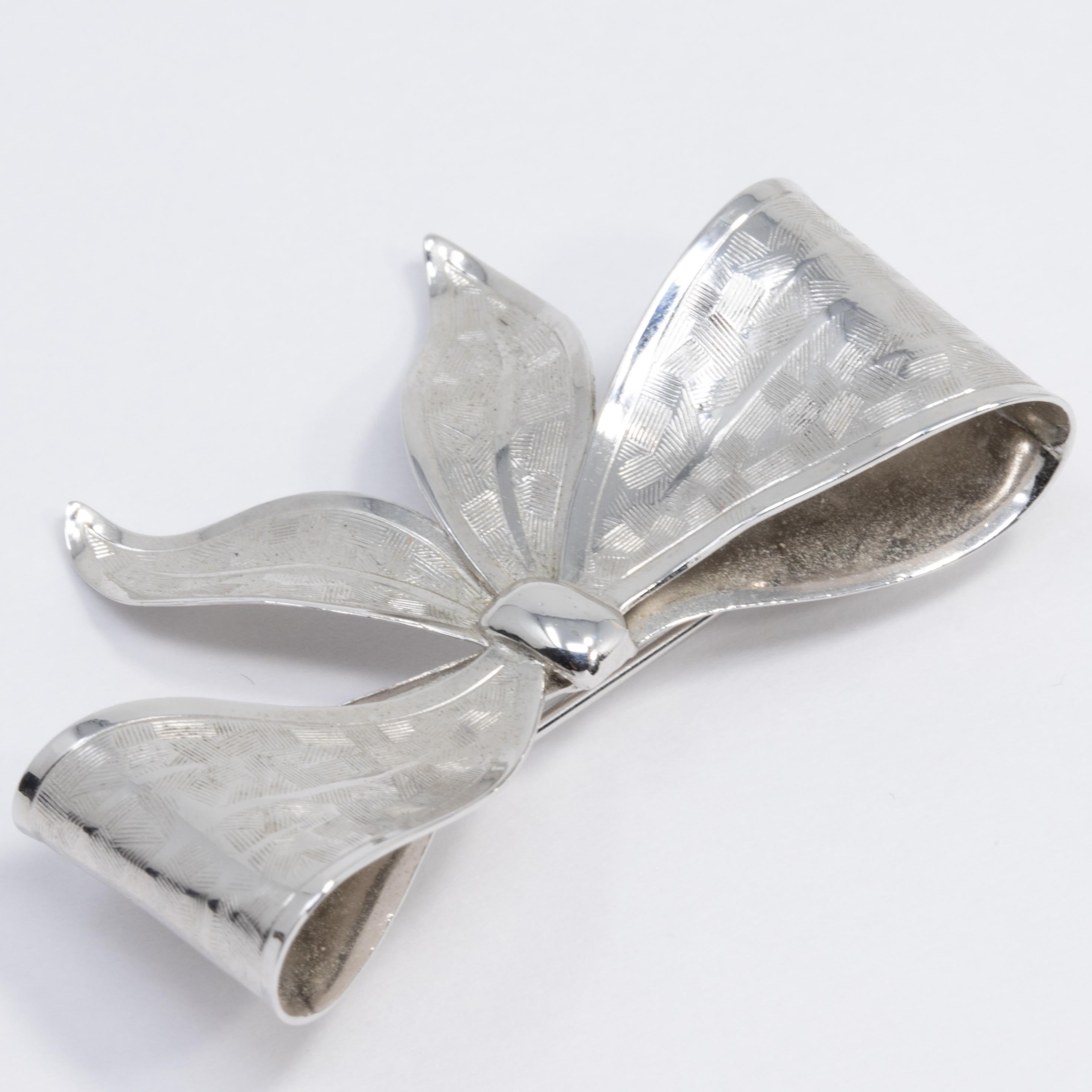silver bow brooch