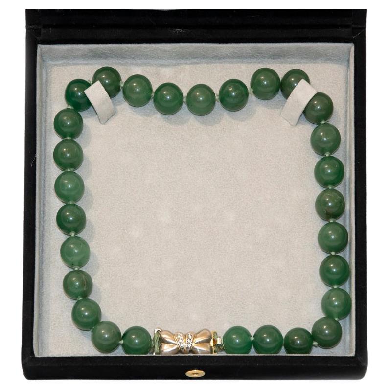 Necklace with Jade Spheres is an original jewel realized in Italy in the 19th Century . 

Green Jade, Silver and brilliants.

Refined and elegant necklace realized with precious materials: the jewel is realized with 28 spheres of dark green jade.