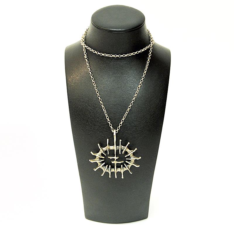 A lovely vintage silver necklace called 'Abstract Sun' designed by Studio Else & Paul, Hadeland Oslo, Norway. This pendant is a typical example of the 1970s ‘new’ vintage look using the technique called ‘lost-wax’ method. The jewelry was first