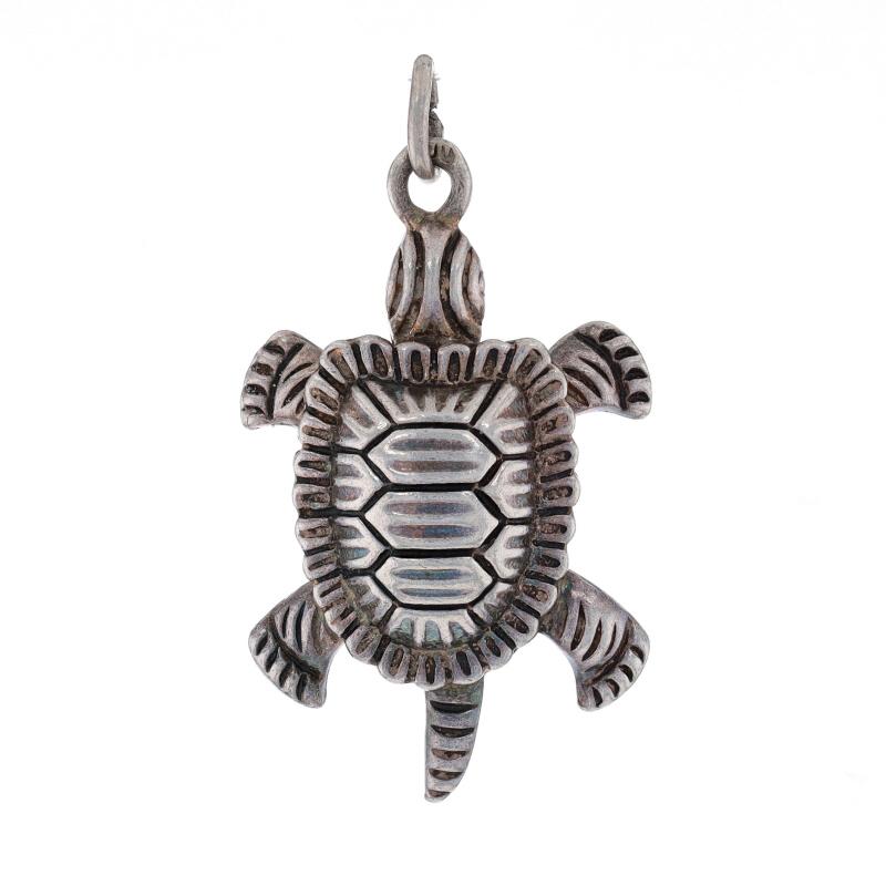 Era: Vintage

Metal Content: 800 Silver

Theme: Turtle, Reptile
Features: Etched Detailing

Measurements

Tall (from stationary bail): 1 3/16