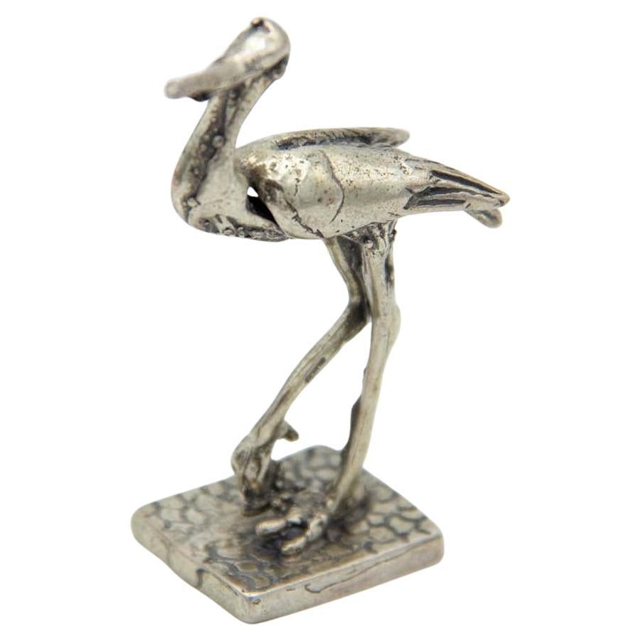 Uccello trampoliere in argento su base rettangolare