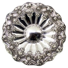 Silver wall tray with 16 sections, shell shape 
raised florals