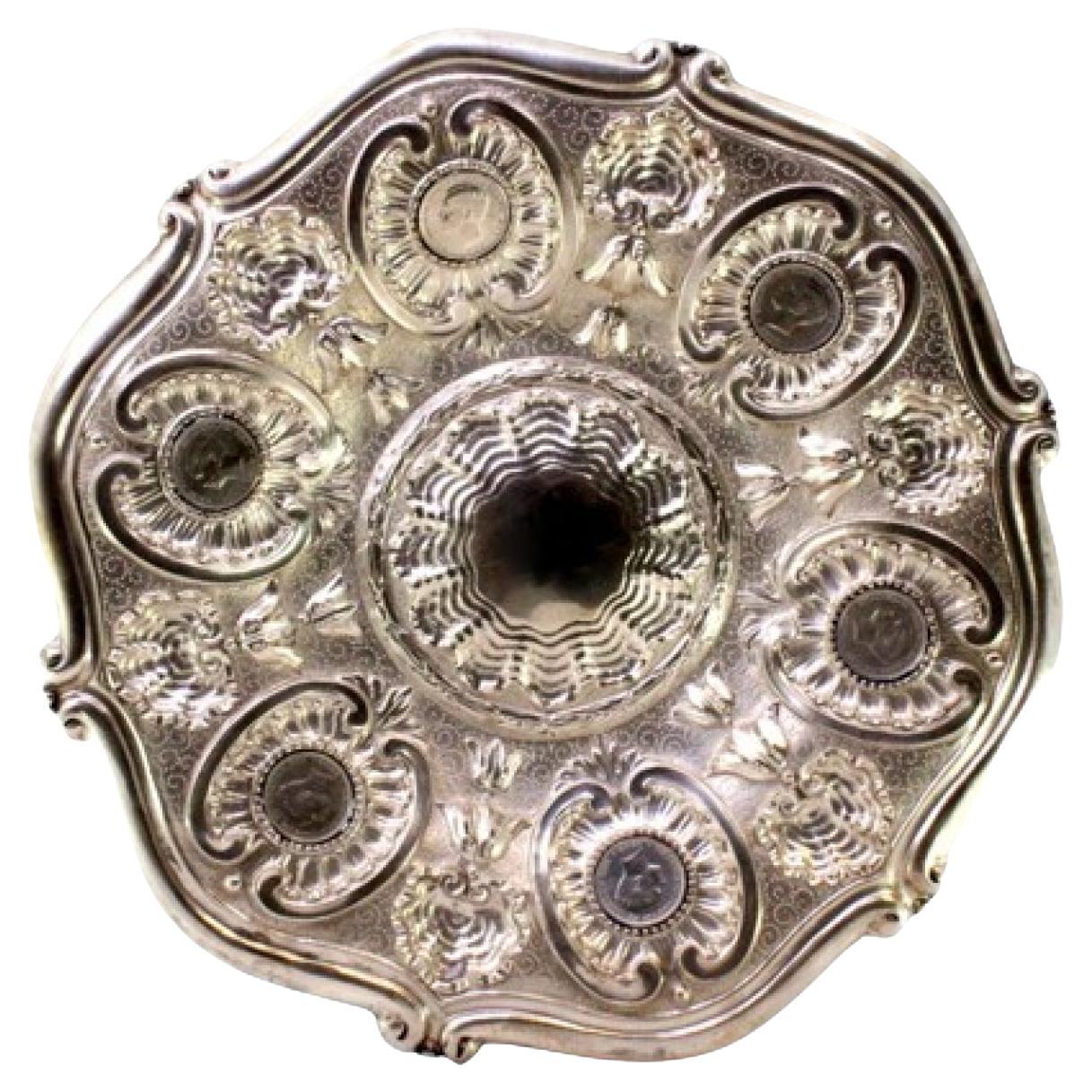 Silver wall tray with shells, floral engravings 
inlaid coins