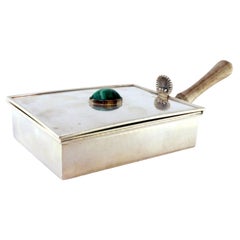 Silver whisk w/ wooden interior, shell lid
faux stone