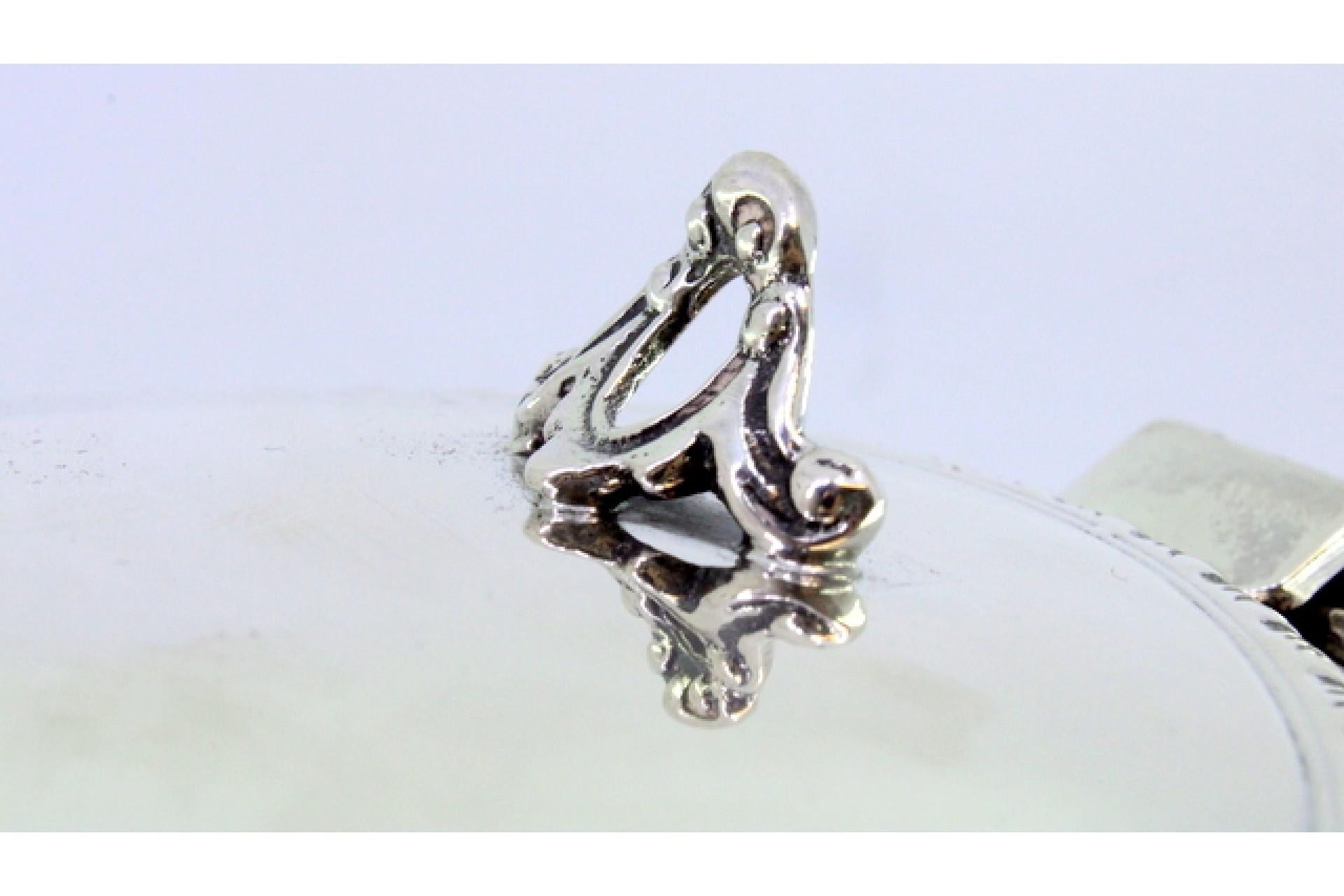 Européen Silver whisk with raised trim on the lid and wooden handle en vente