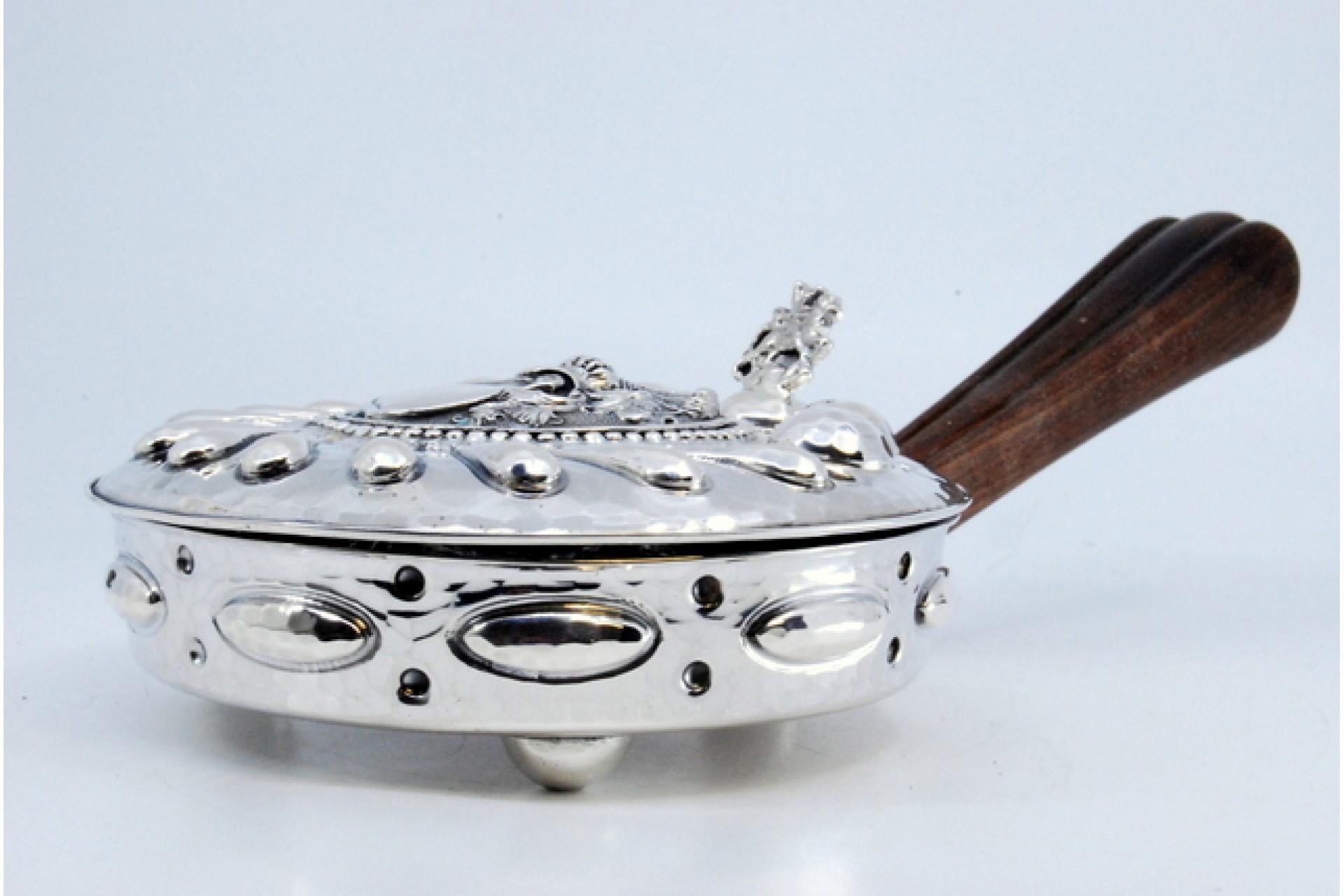 Européen Silver whisk with reliefs, knight's helmet, coat of arms and wooden handle en vente