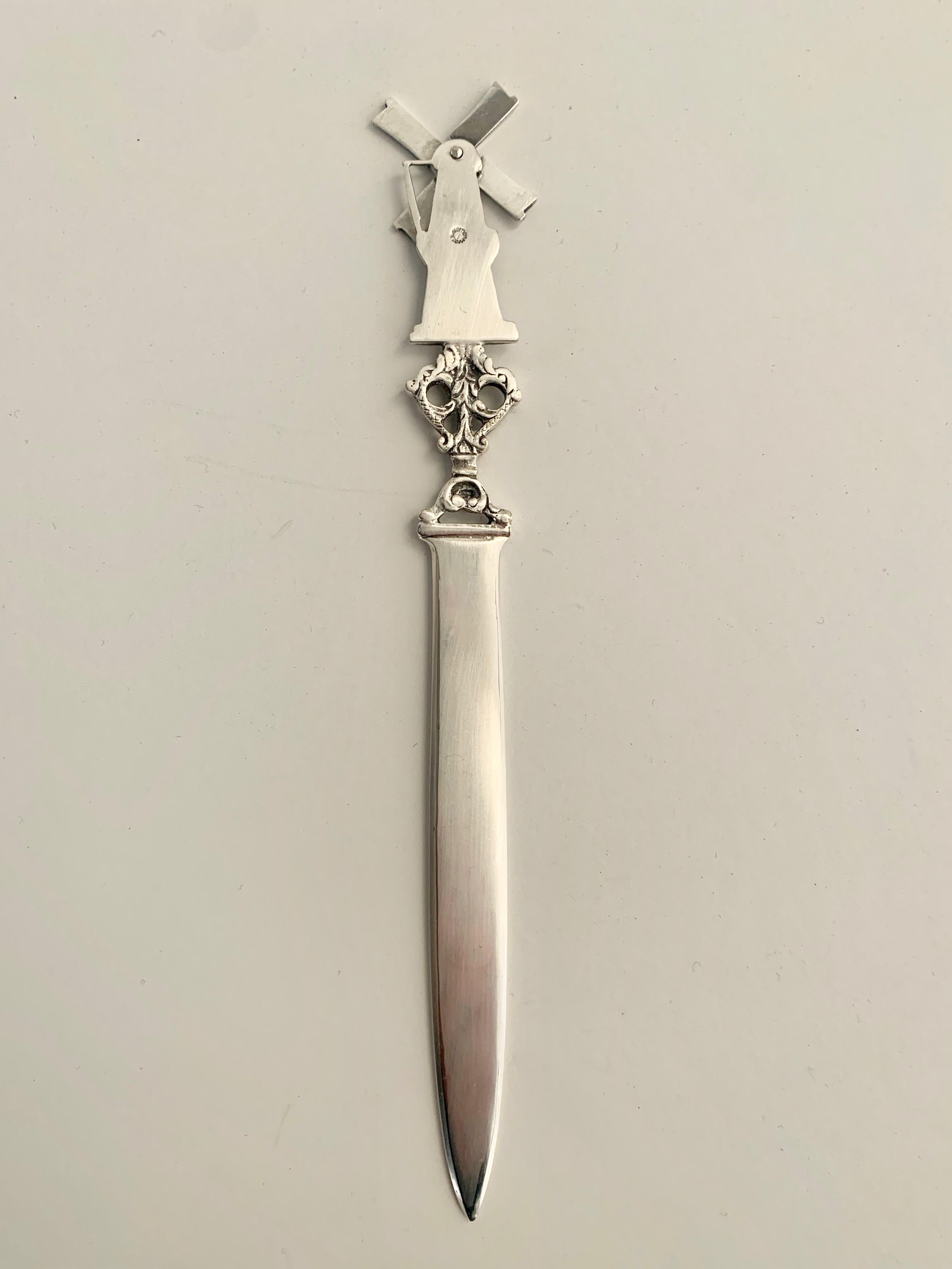 A wonderful Dutch silver letter opener with a windmill with blades that actually turn. Made in Holland. A wonderful addition to many desks.