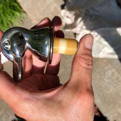 Tappo per vino in argento con testa di anatra o di germano reale