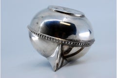 Silver wine jug with raised surround on the frieze