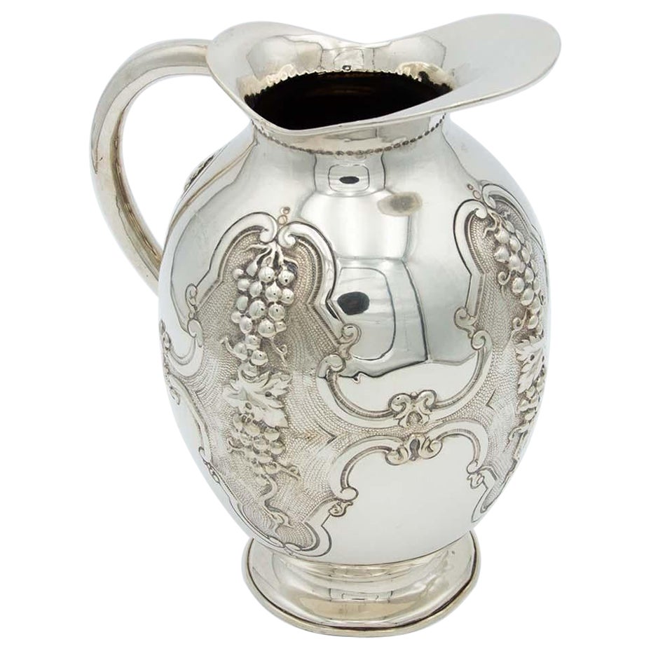 Silver wine jug with reliefs