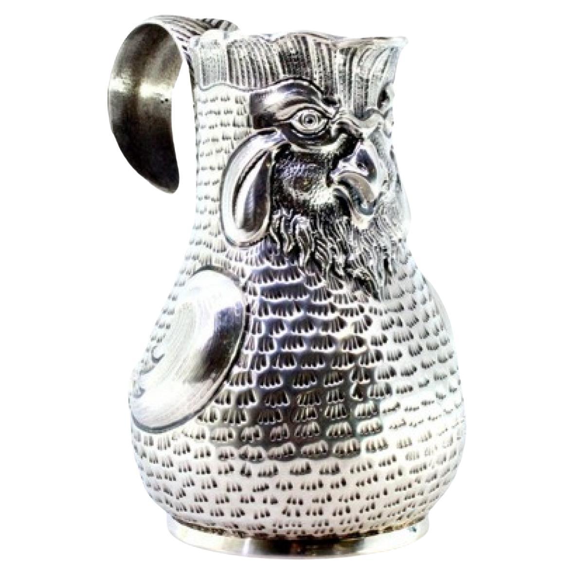 Silver wine jug with rooster-shaped reliefs For Sale