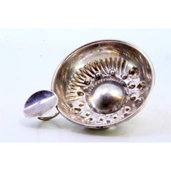 Silver wine tasting cup with embossed reliefs