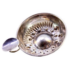 Silver wine tasting cup with embossed reliefs