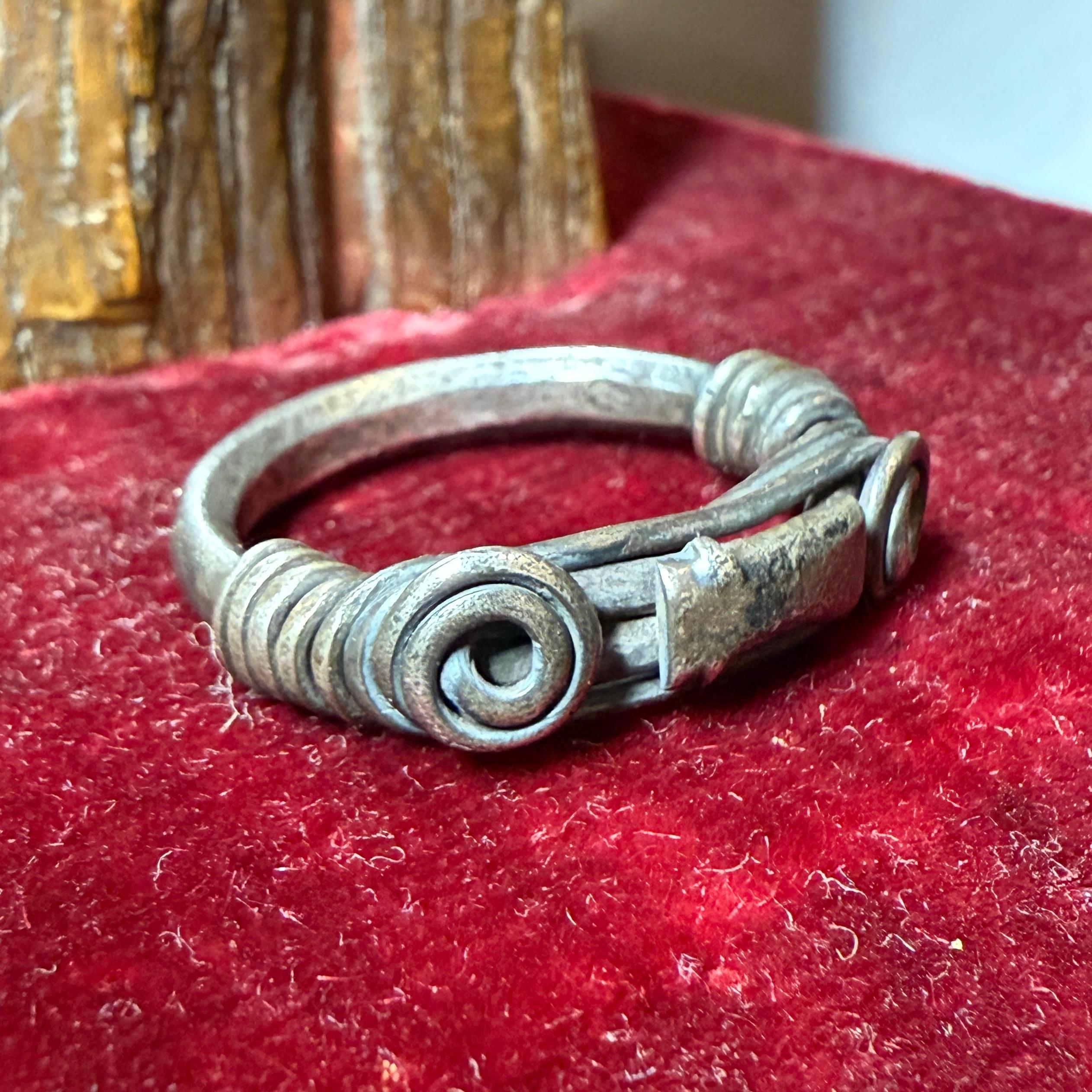 Silver Ring with Spiralled Terminals and Axe-Motif. Balkans, 1st–2nd century AD. For Sale 9