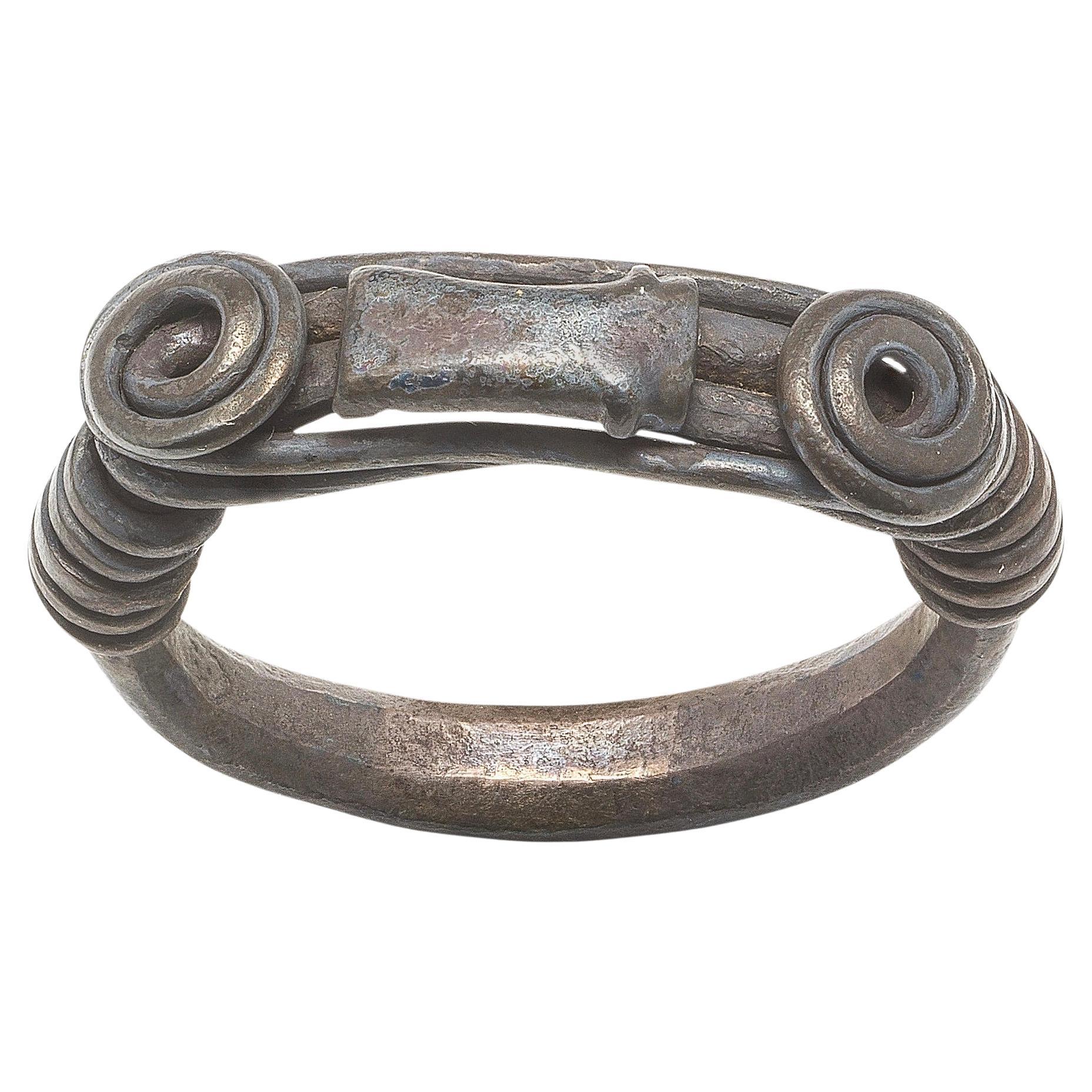 Silver Ring with Spiralled Terminals and Axe-Motif. Balkans, 1st–2nd century AD. For Sale