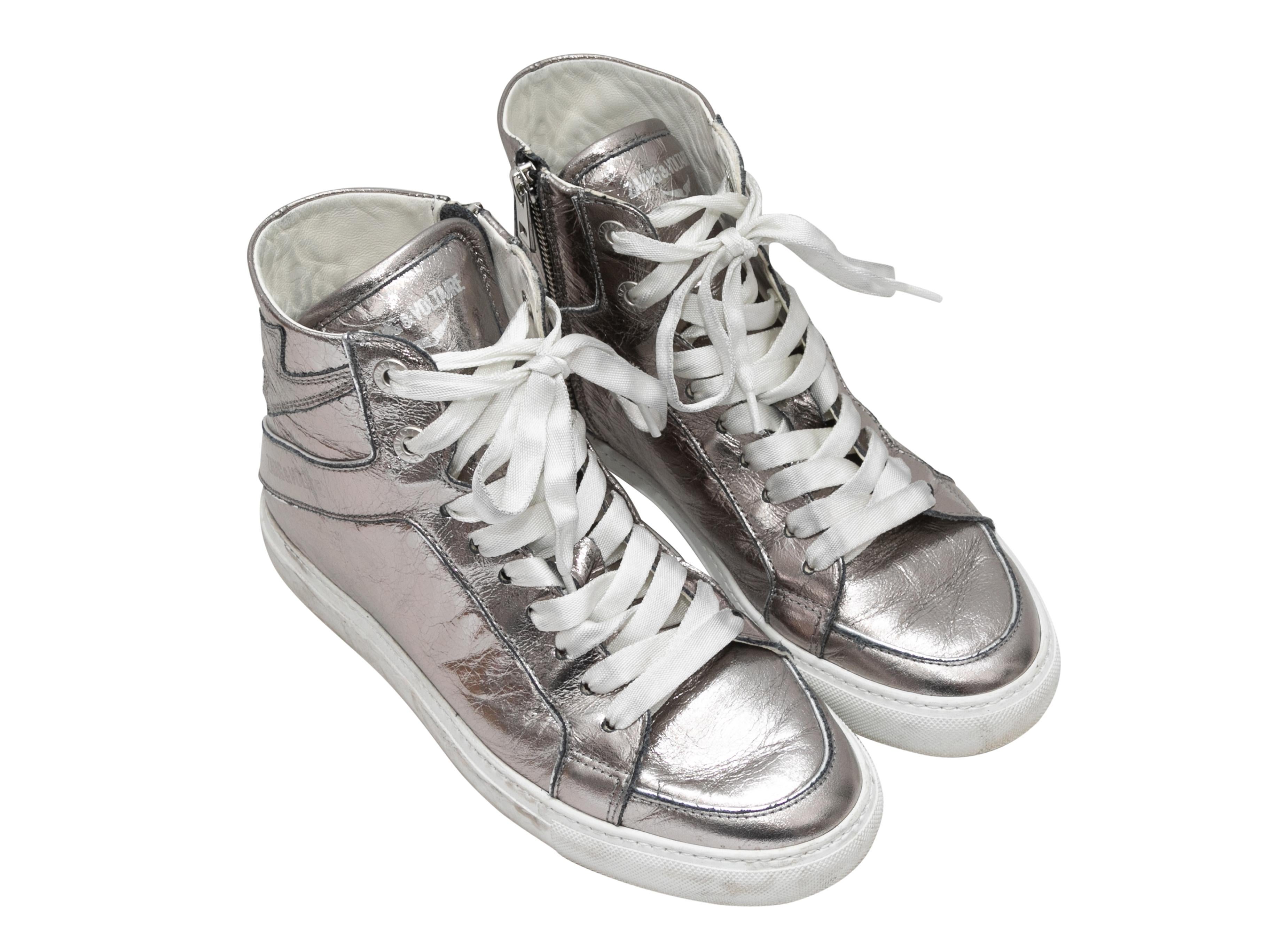 Silver metallic leather high-top sneakers by Zadig & Voltaire. Rubber soles. Lace-up detailing at tops. Zip closures at inner sides. 4.5