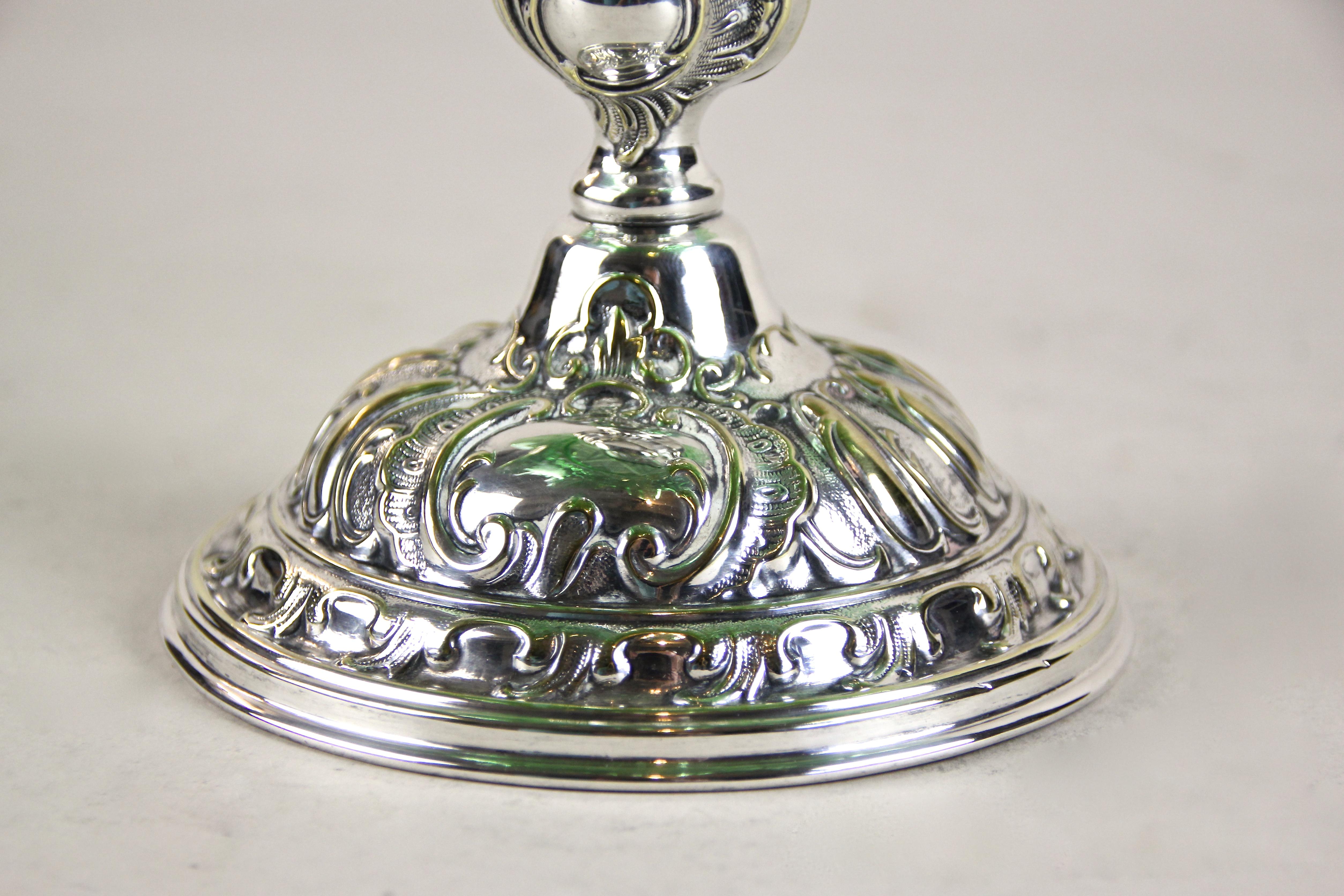 Delightful silvered Art Nouveau centerpiece with ruffled glass bowl from Austria, circa 1900. The beautiful green shining mouth blown glass bowl sits on a silver plated artfully made brass stand showing some minimal abrasion. The extraordinary