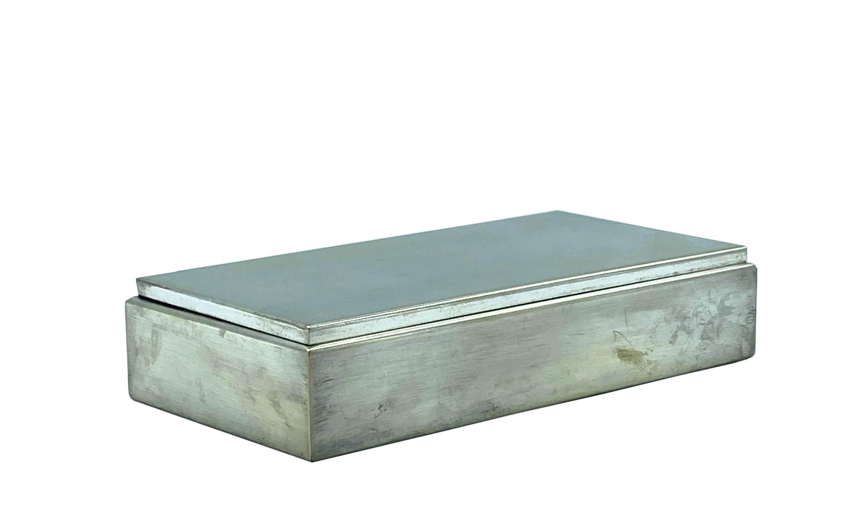 Silver-plated brass box and fabric-covered interior from 1970.