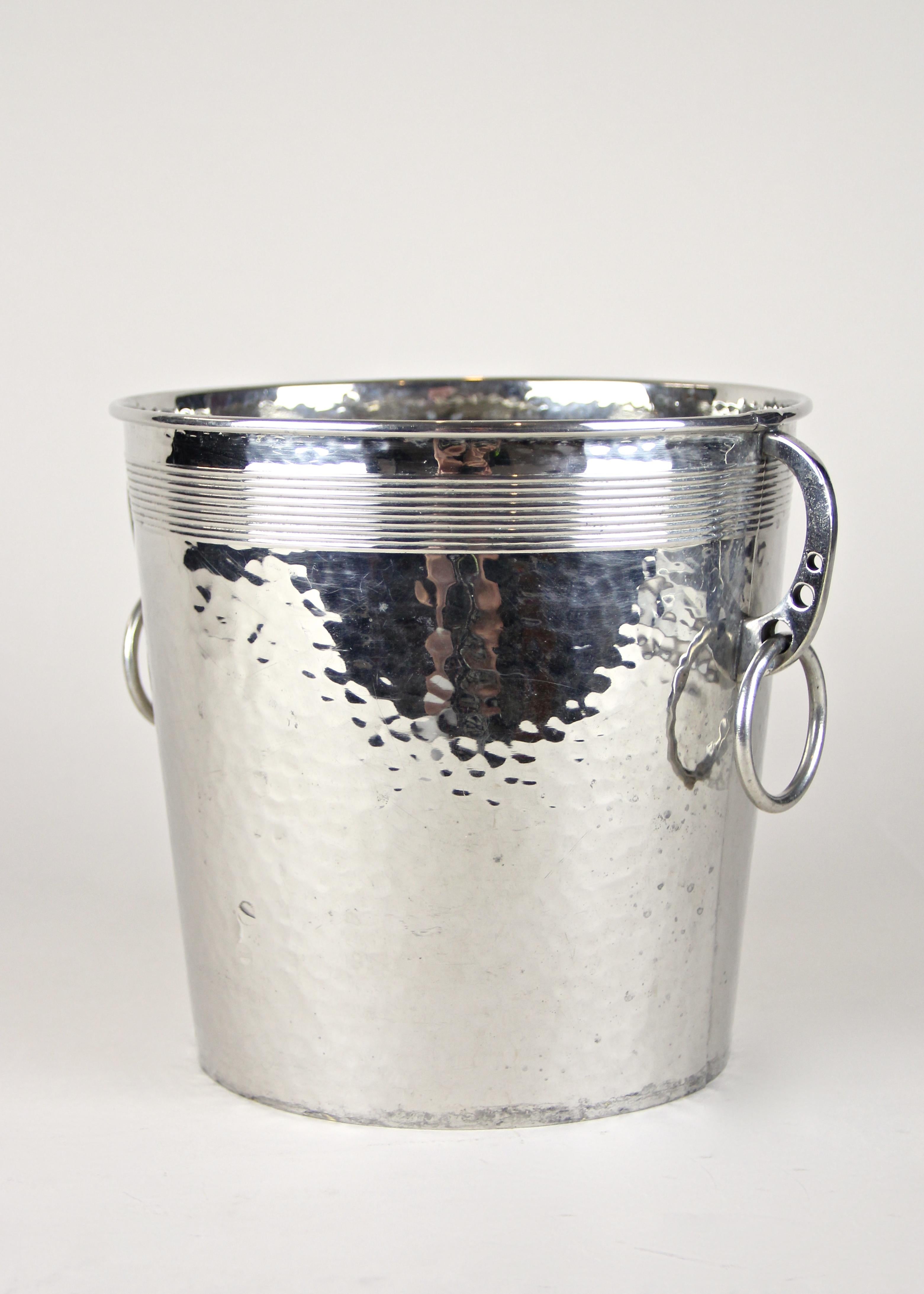 Lovely silvered brass champagne cooler artfully processed by the famous company of WMF. Coming from the Art Nouveau period in Germany circa 1915, this beautiful designed silvered bottle holder shows an exclusive hammer finished surface and great