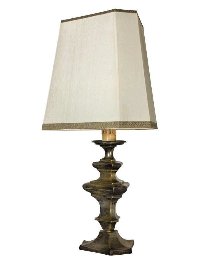 A Flemish lamp (formerly a candlestick) in silvered brass.