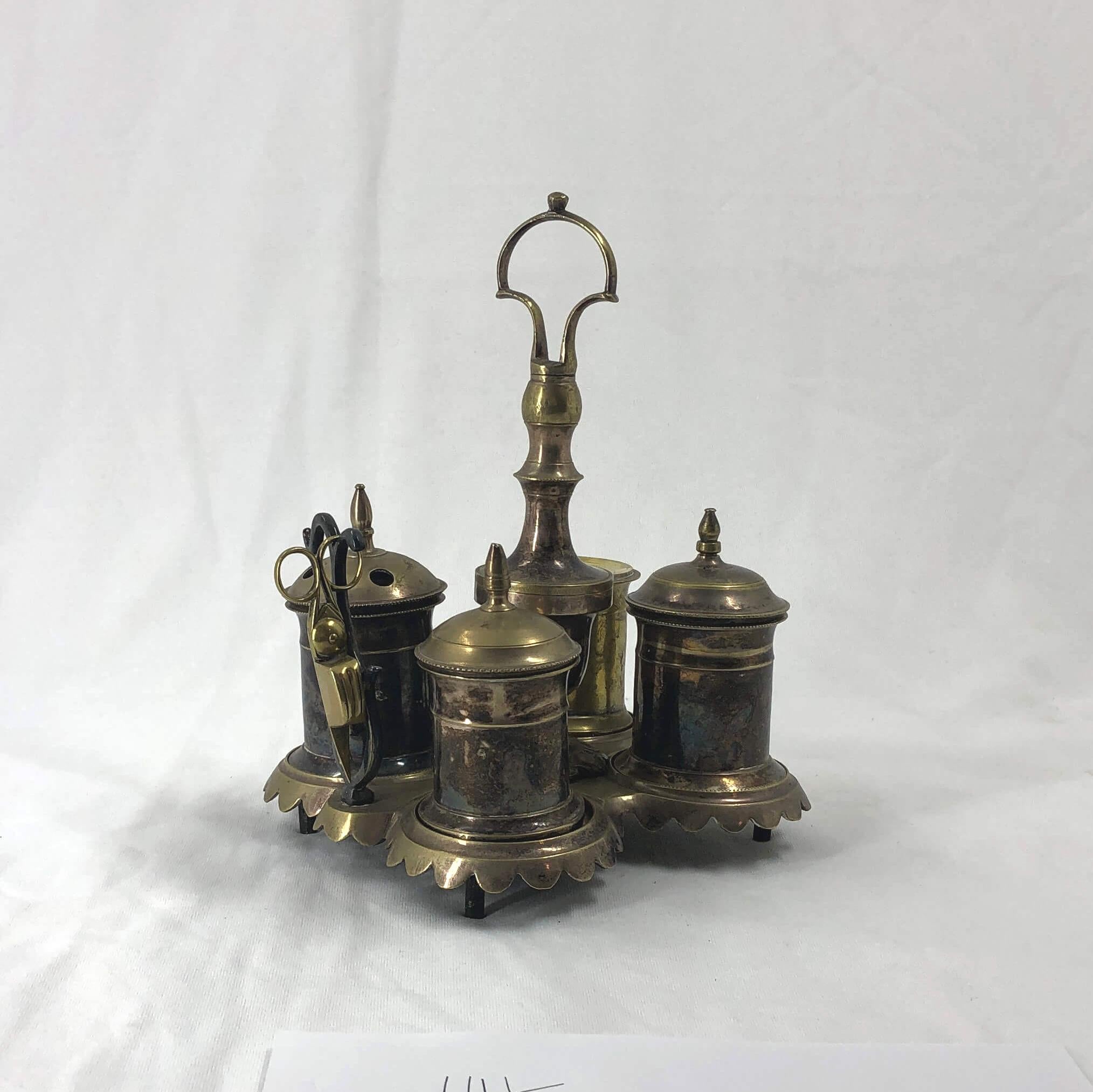 An early silvered brass four-piece Standish with a scalloped edge base and handle.