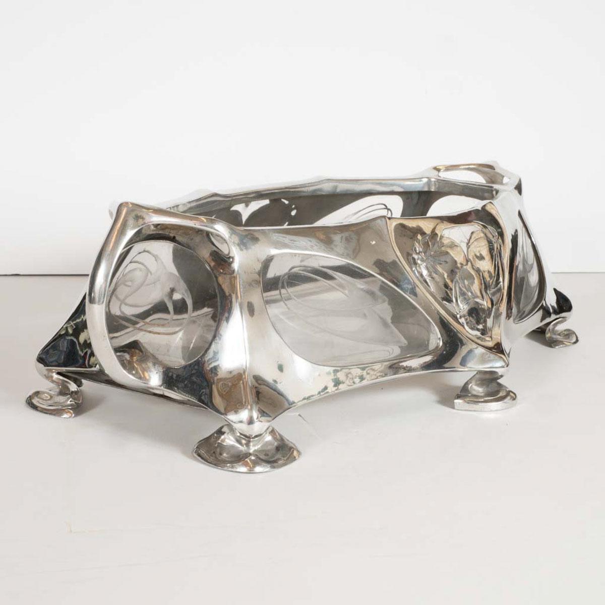 Sculptural foliate motif cast and silvered bronze box with interior etched glass.