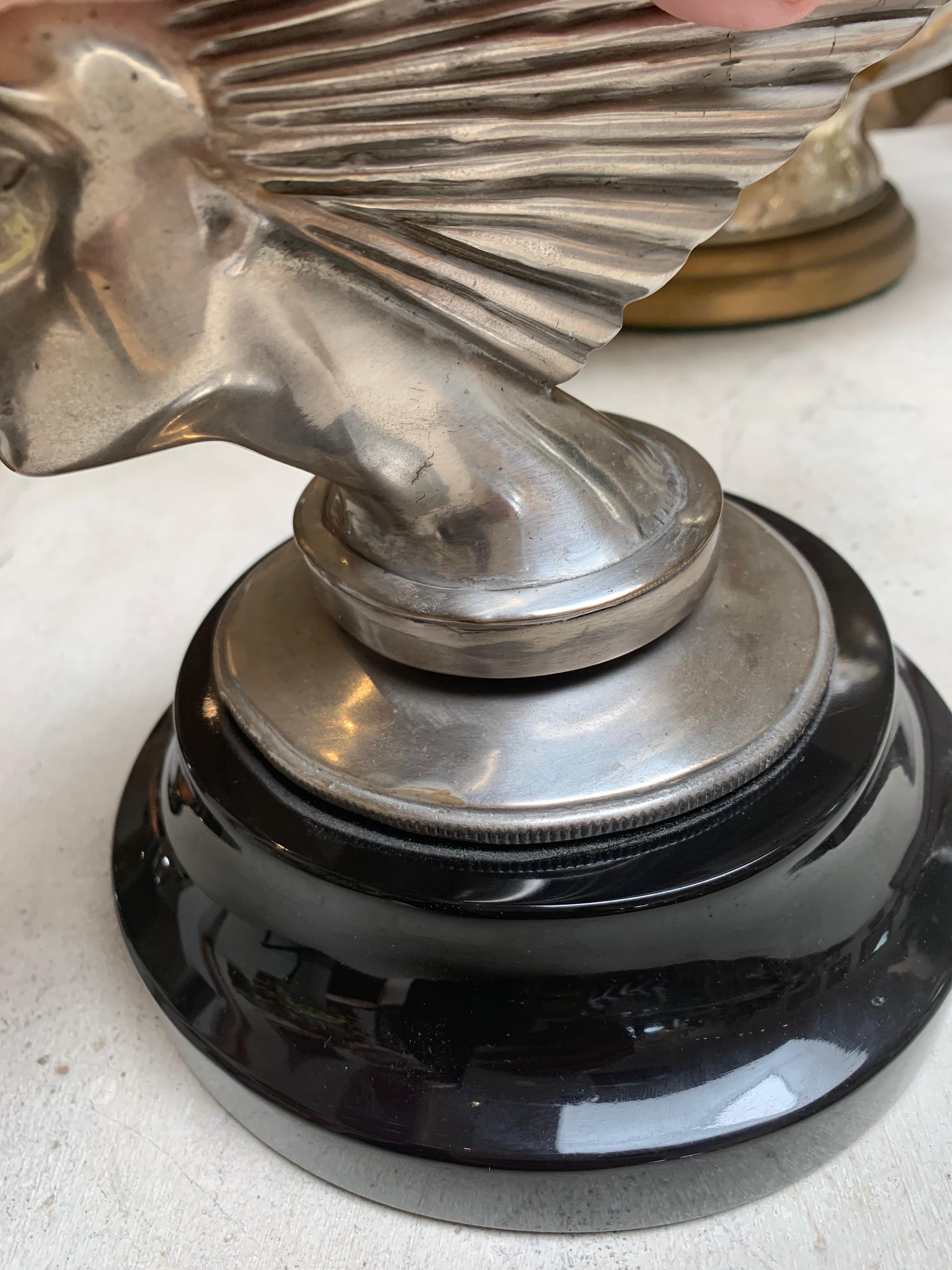 Art Deco sculpture replica of Lalique mascot, silvered bronze, on black marble base.
