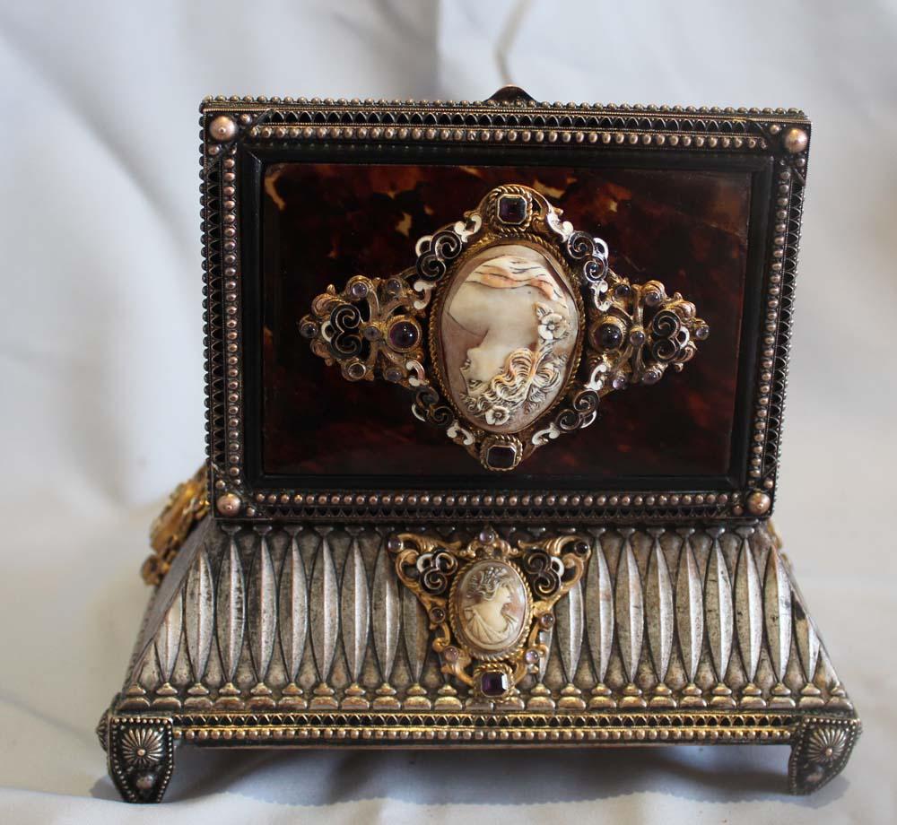 Silvered bronze, enamel, tortoiseshell jewelry casket with five carved cameo portraits. The casket with elaborate decoration around each side which include carved cameo portrait of young women within gilt bronze bezels and surrounded by gilt bronze