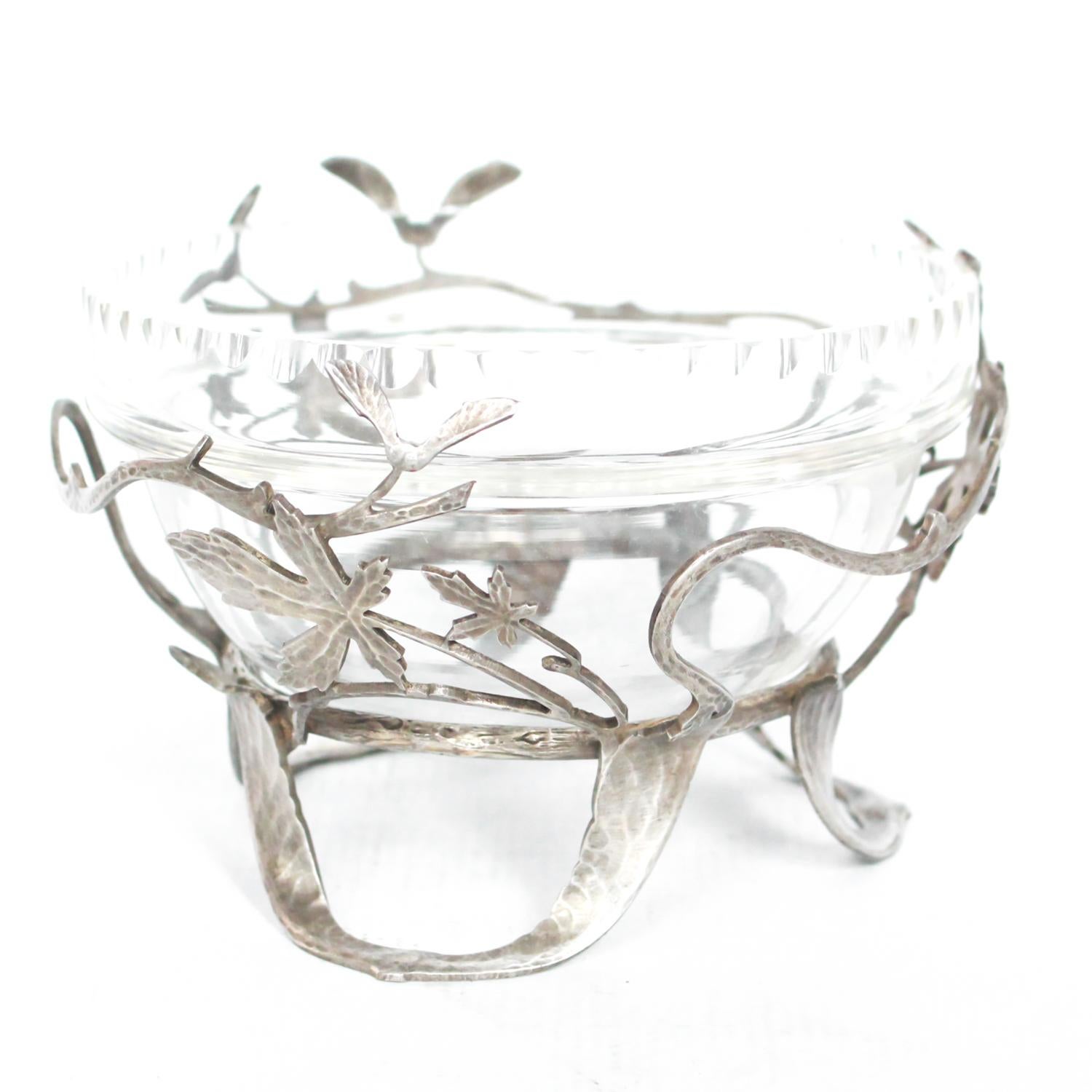 Art Deco, silvered bronze and glass dish. Designed with hand-hammered branches and leaves. Removable original glass bowl. Signed 'Val' to leg.

Dimensions: H 8.5cm D 12cm

Origin: French

Date: circa 1910

Item No: 2808193.