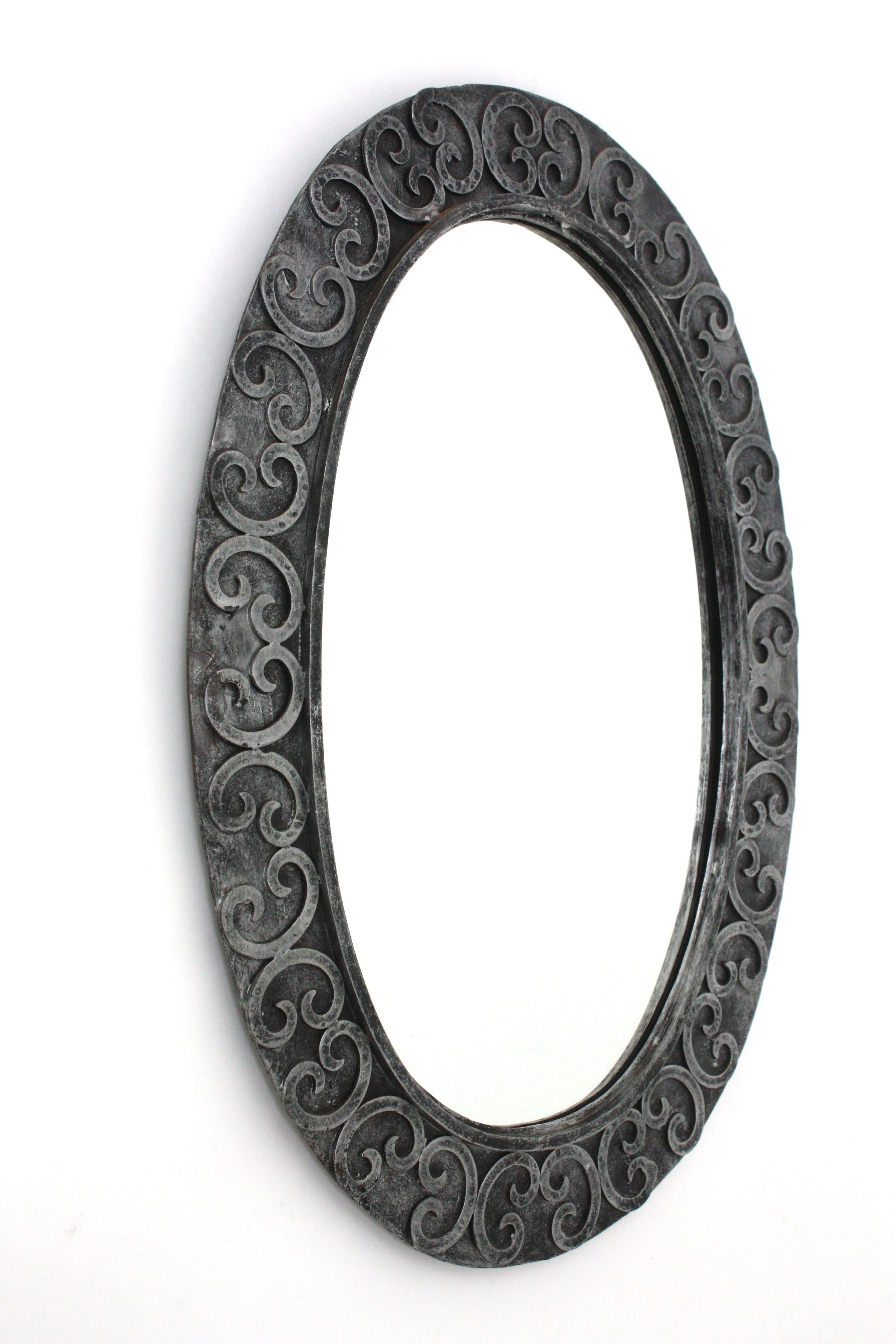 Silvered Brutalist Oval Mirror in Wrought Iron with Scroll Decorations In Good Condition For Sale In Barcelona, ES